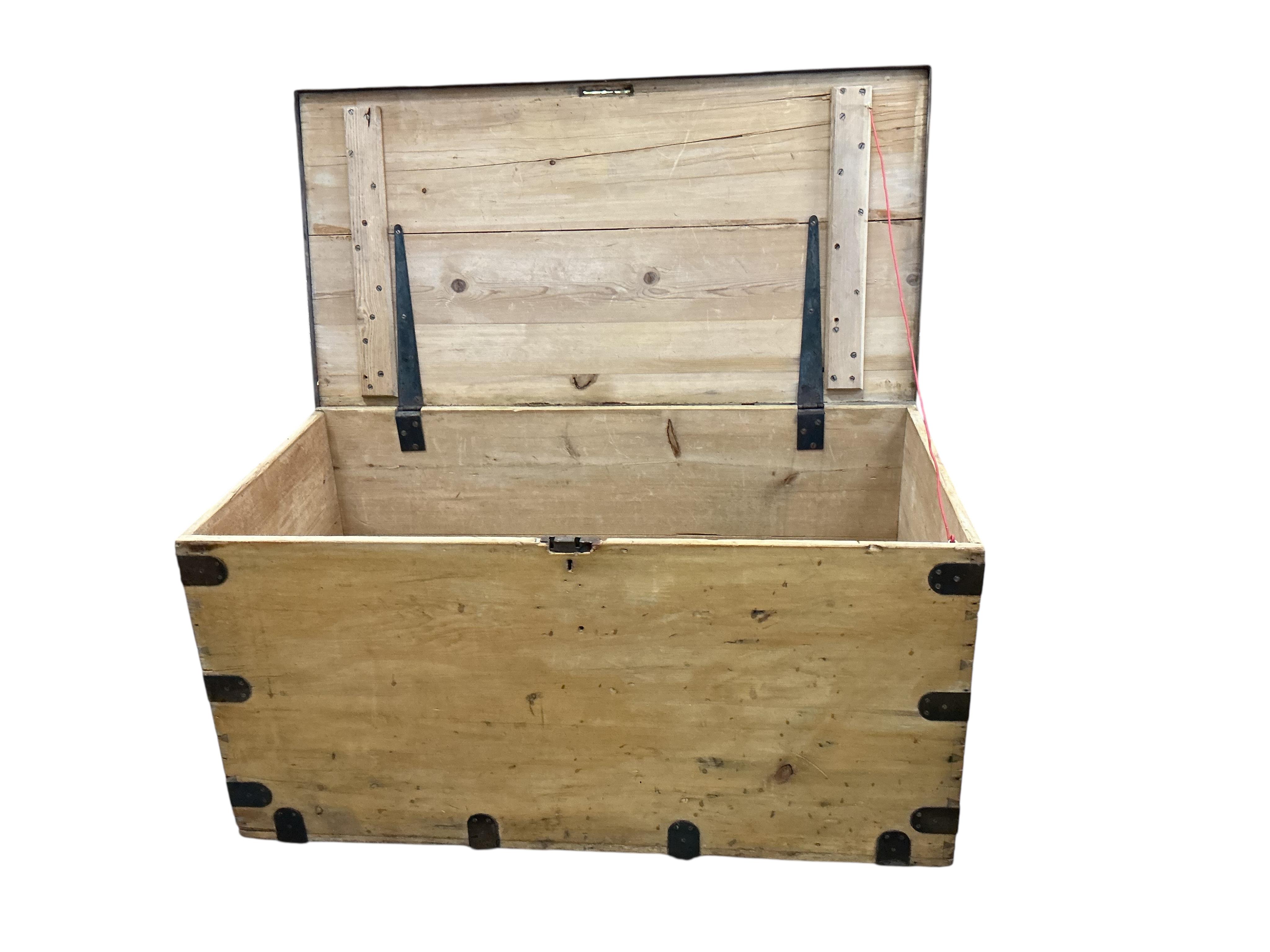 A large iron bound pine trunk, width 120cn, depth 61cm, height 61cm